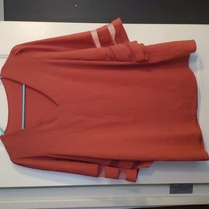 Pink blouse with mesh stripes on sleeves. Size M.